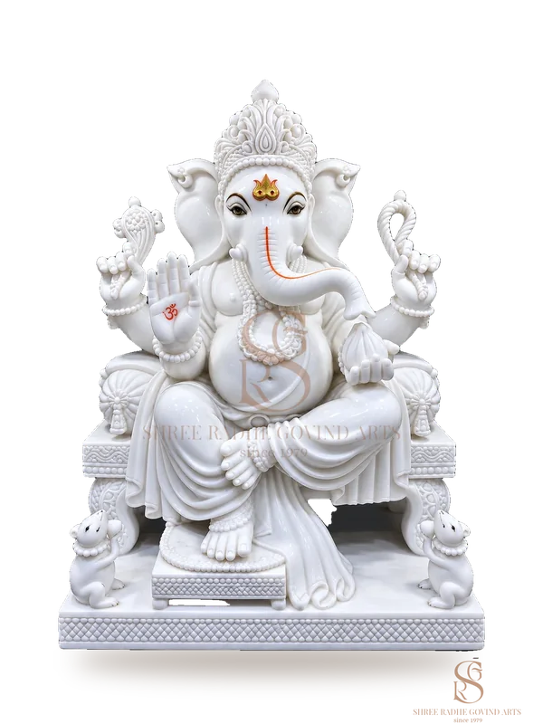 Ganesh ji on a carved throne in white marble