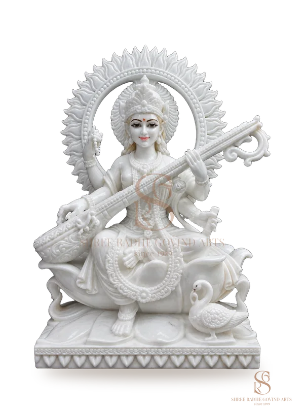 Saraswati Maa with veena and swan, in white marble with a carved halo